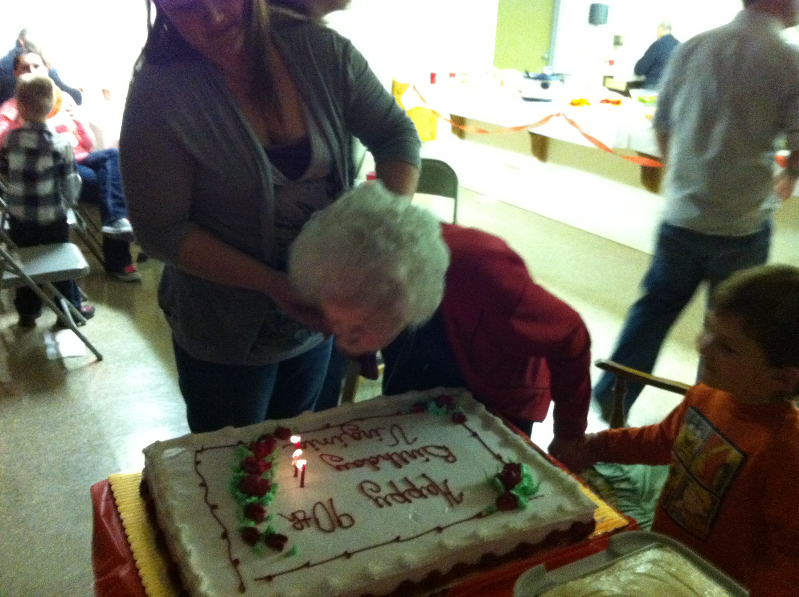 Nanny blowing out candles